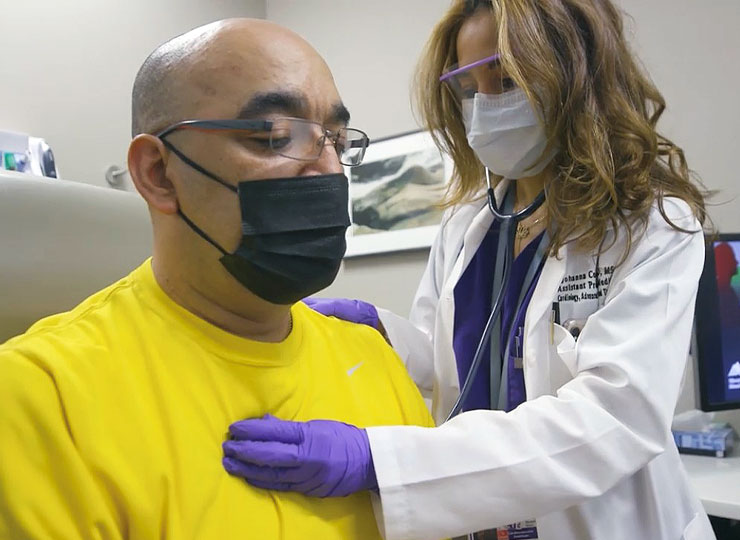 Photo of doctor checking patient's heart rate